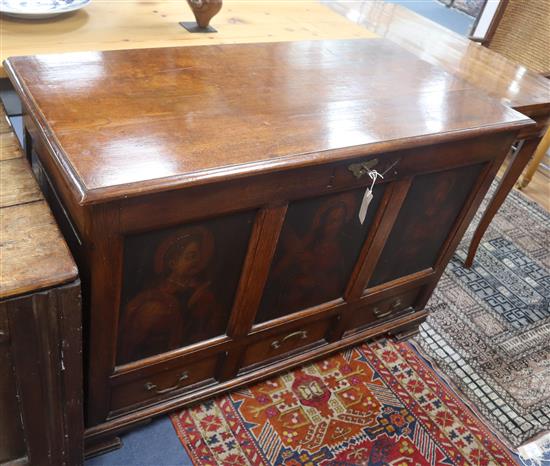 A mid 19th century oak mule chest, the front panels oil painted with three late 16th century studies of Saints, W.116cm